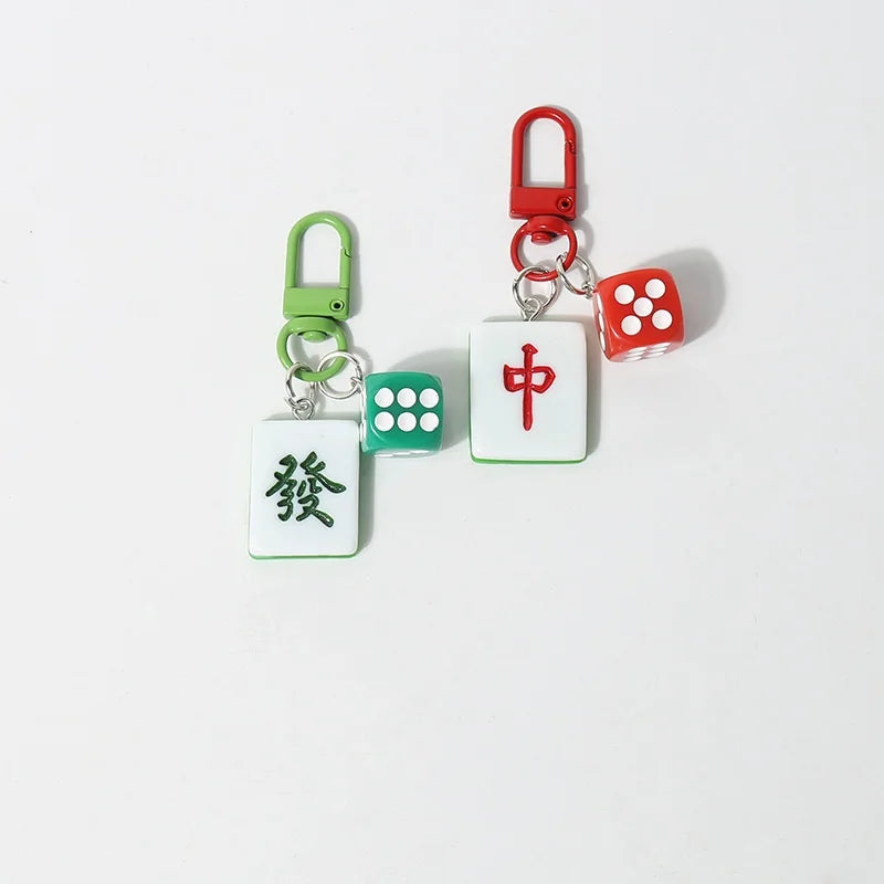 Mahjong tile keychains with dice charms